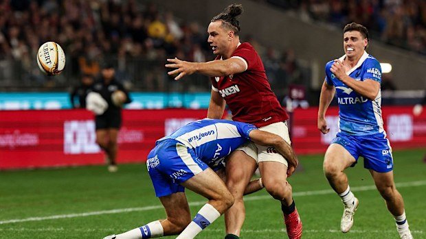 James Lowe of the British and Irish Lions offloads while setting up for his side's fourth try.