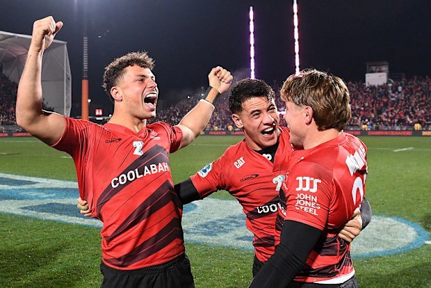 Macca Springer, Rivez Reihana and James O'Connor of the Crusaders celebrate victory.