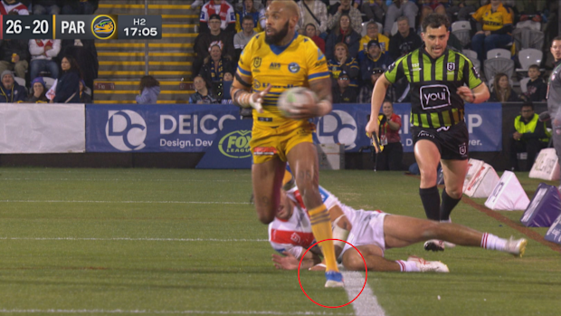 A blade of grass separates the Parramatta Eels and a try against the Dragons.