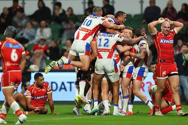 The Knights celebrate a try.