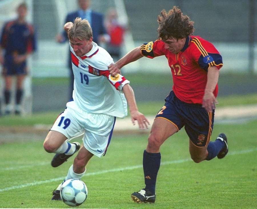 Carles Puyol battles Marek Heinz for the ball Carles Puyol battles Marek Heinz for the ball