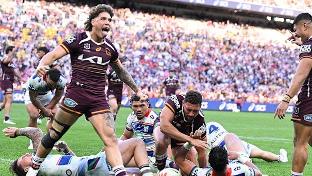 Reece Walsh celebrates a Broncos try against the Warriors.