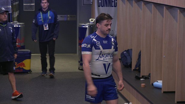 Benched Bulldogs star Reed Mahoney looks dejected in the sheds.