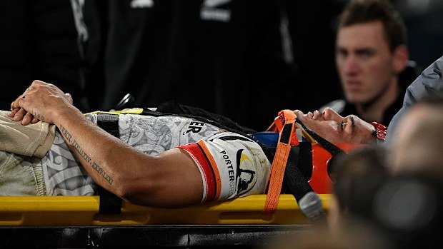 Quinn Tupaea of the Chiefs receives medical attention.