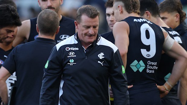Michael Voss, coach of Carlton walks from the the 3/4 time huddle during the round 15 AFL match between Carlton and North Melbourne.