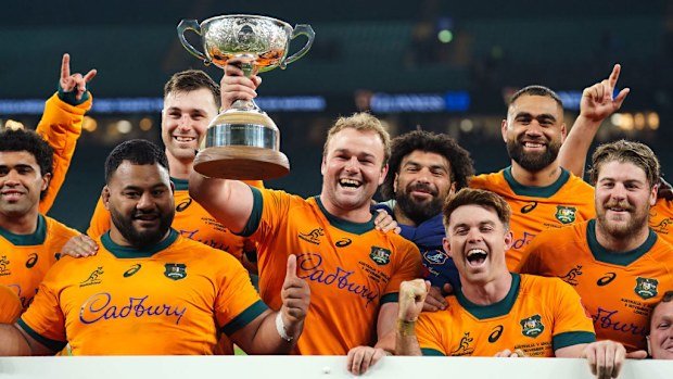 Australia's Harry Wilson lifts the Ella-Mobbs Trophy following a late victory.