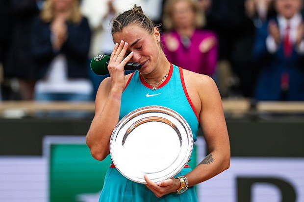 Aryna Sabalenka appears emotional as she speaks.