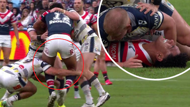 Siua Wong is tackled by Karl Lawton.