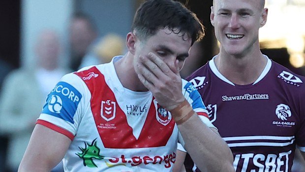 SYDNEY, AUSTRALIA - JUNE 16: Kyle Flanagan of the Dragons walks off for HIA assessment as Daly Cherry-Evans of the Sea Eagles exchanges pleasantries during the round 15 NRL match between Manly Sea Eagles and St George Illawarra Dragons at 4 Pines Park, on June 16, 2024, in Sydney, Australia. (Photo by Jeremy Ng/Getty Images)