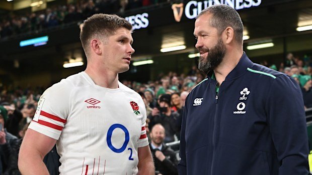 Owen Farrell of England converses with Andy Farrell of Ireland.