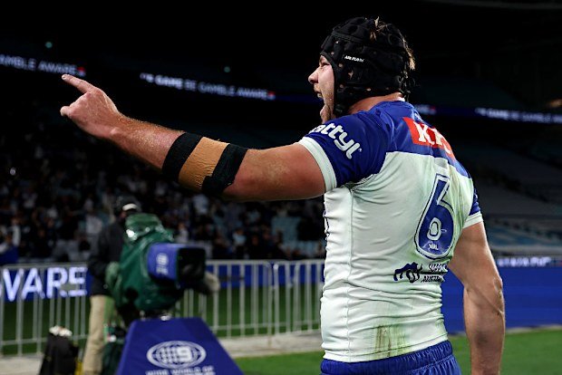 Matt Burton of the Bulldogs celebrates his try.