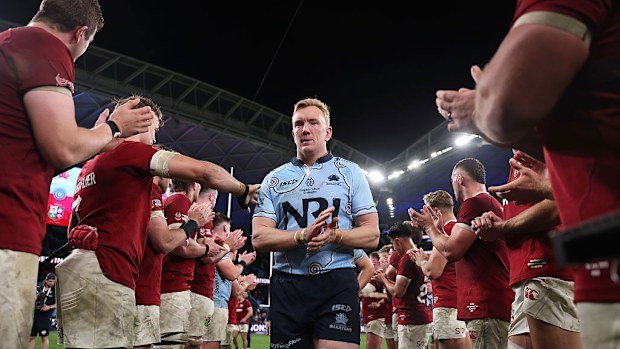 Hugh Sinclair of the Waratahs thanks British & Irish Lions players.