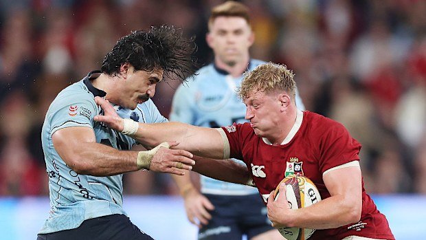 Jac Morgan of the British and Irish Lions fends off Charlie Gamble of the Waratahs.