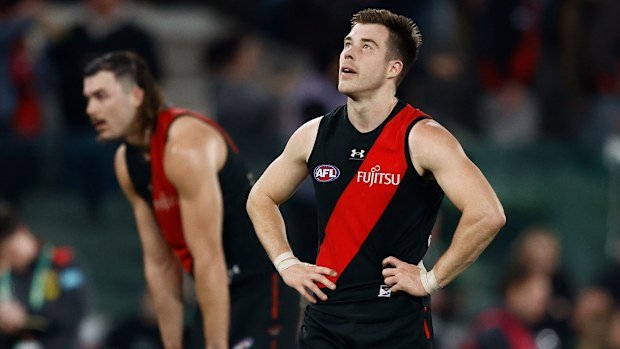 Essendon skipper Zach Merrett is dejected after the loss to Gold Coast in round 22.