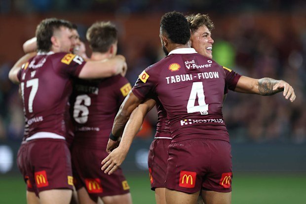 Reece Walsh and Hamiso Tabuai-Fidow of the Maroons celebrate victory during game one of the 2023 State of Origin series.
