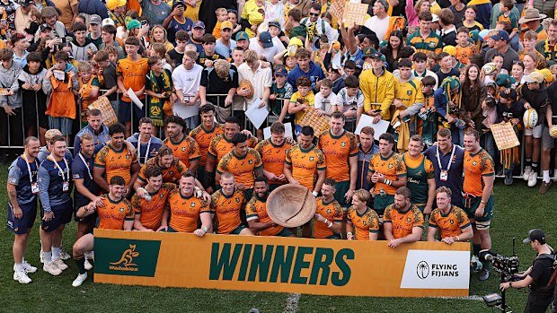 Wallabies players celebrate with the Vuvale Bowl.