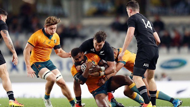 Marika Koroibete of the Wallabies is tackled by David Havili of the All Blacks.