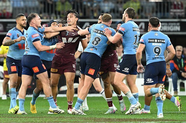 Tino Fa'asuamaleaui and NSW players engaged in a tussle during game two of the 2025 State of Origin series.